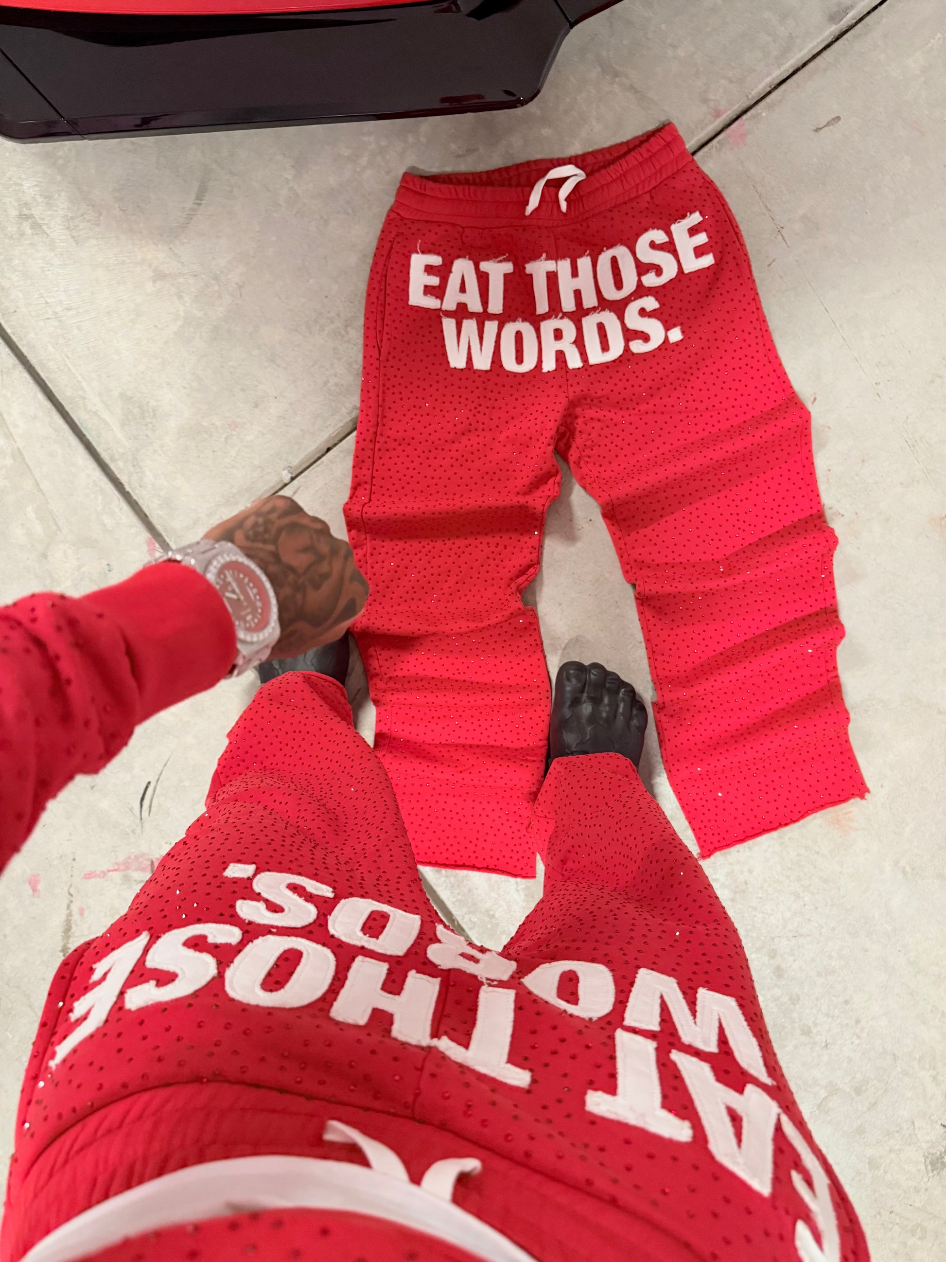 RED " EAT THOSE WORDS " RHINESTONE SWEATPANTS